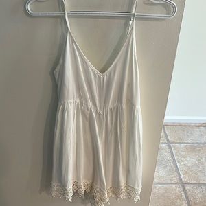 Toni White Romper. Worn a few times and in perfect condition. Adjustable straps.